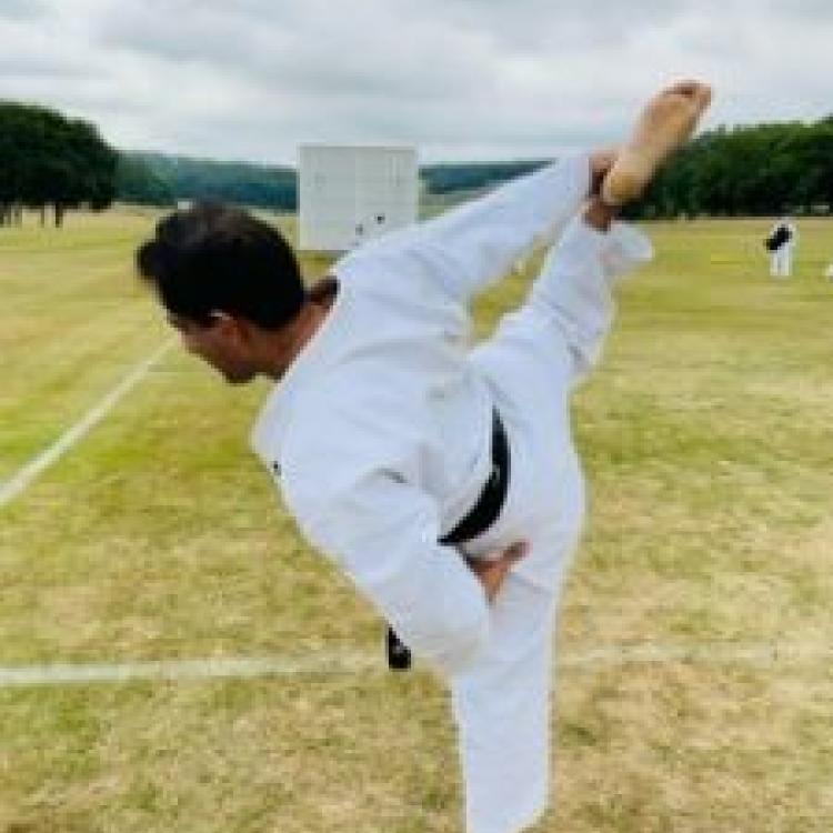 Sensei Shaz Shahid 6th Dan, demonstrating advanced stretching